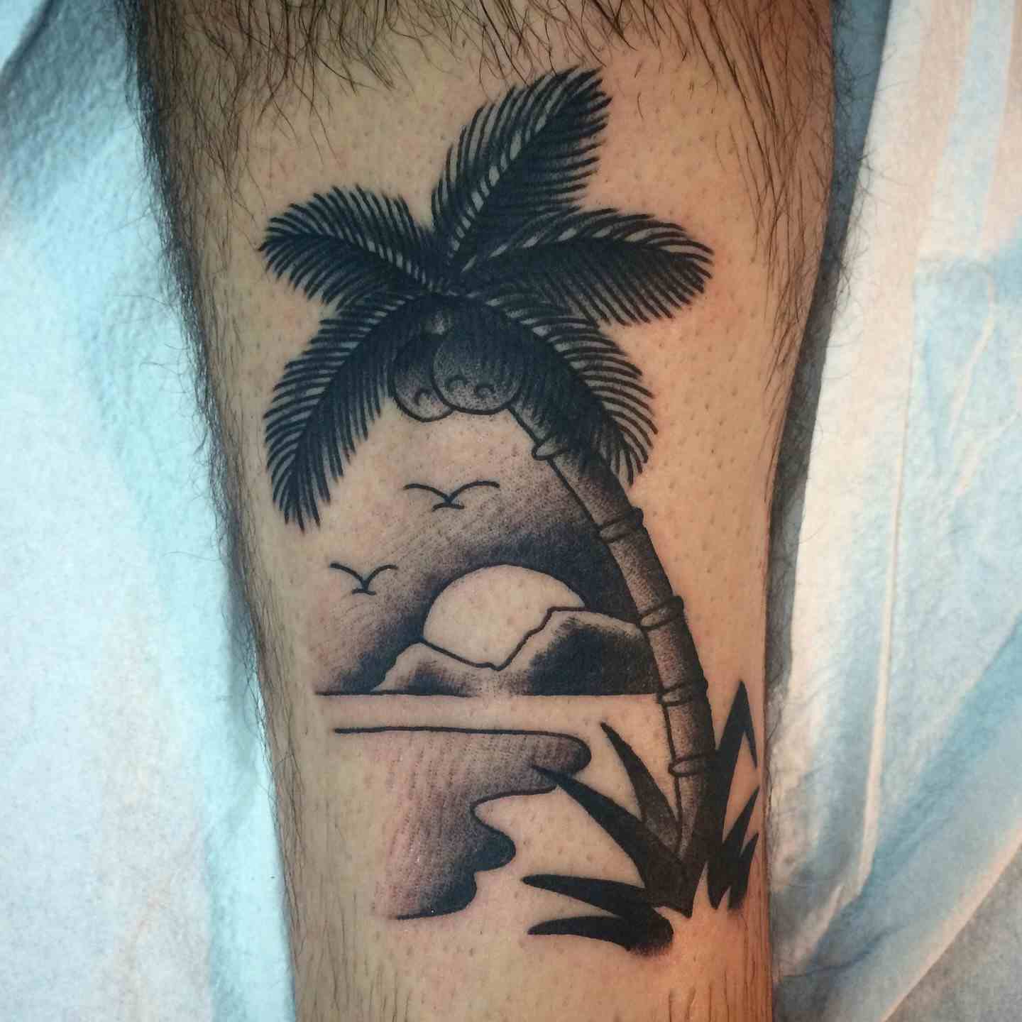Palm tree island tattoo