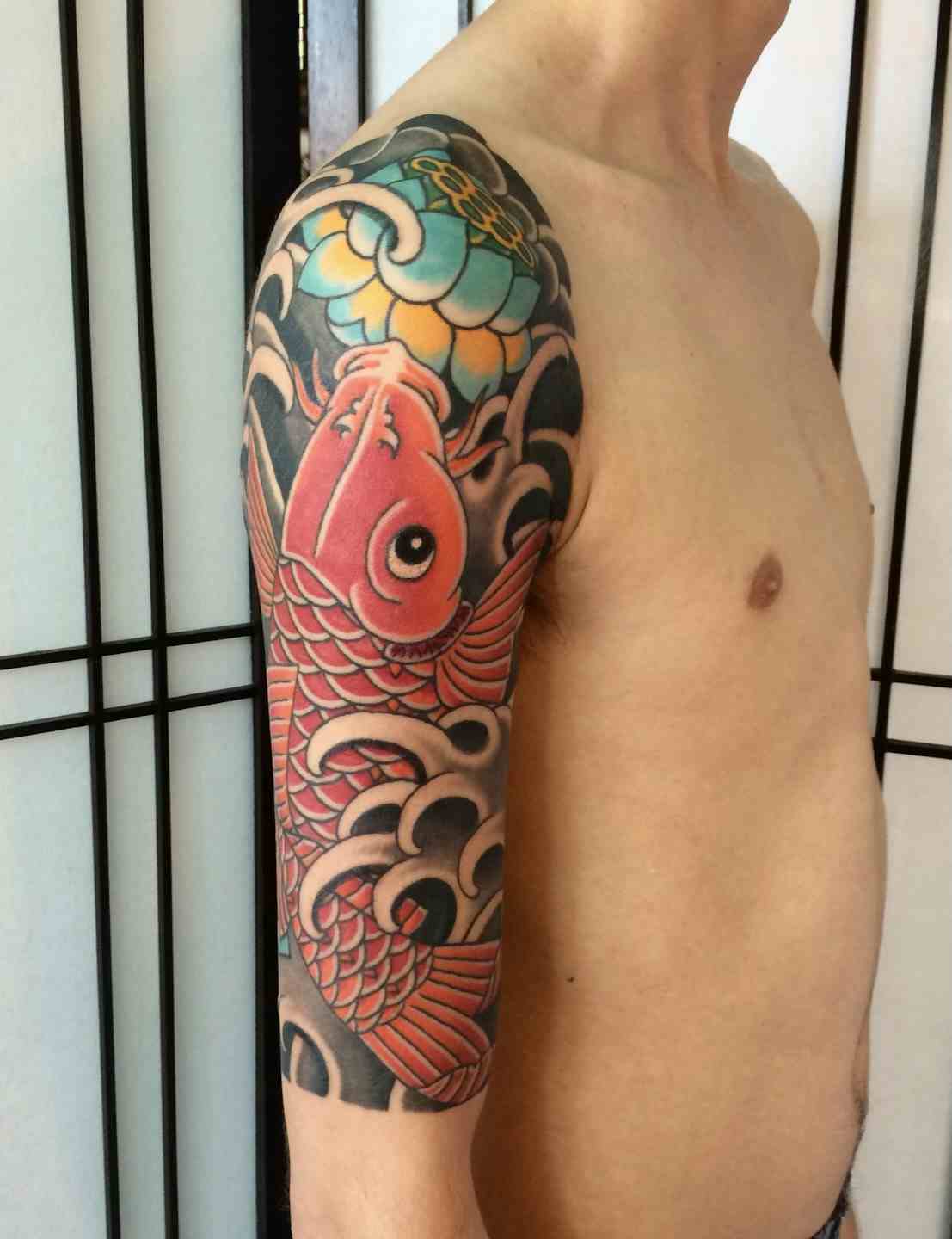 Japanese lotus koi fish sleeve tattoo