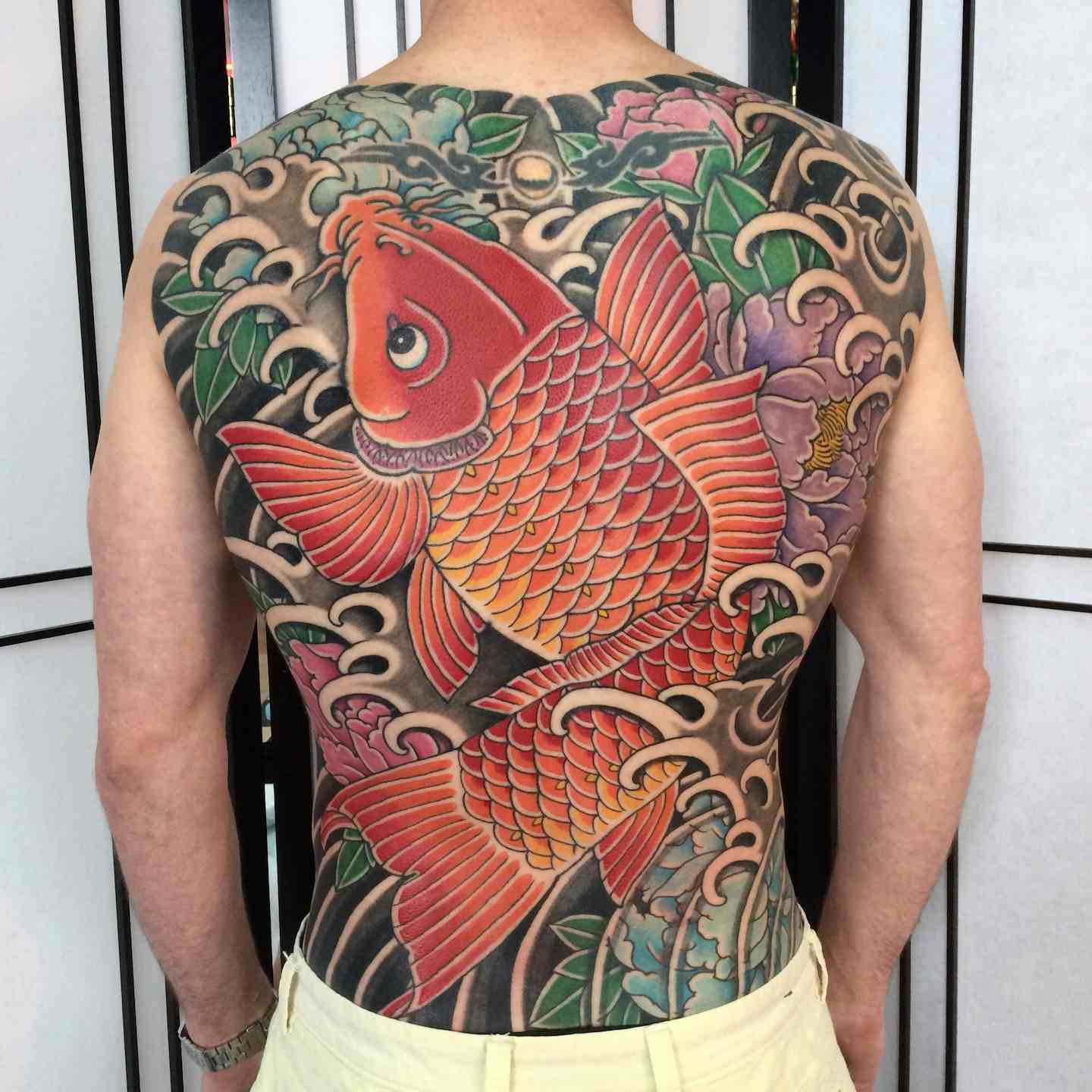 Japanese peony koi fish backpiece tattoo