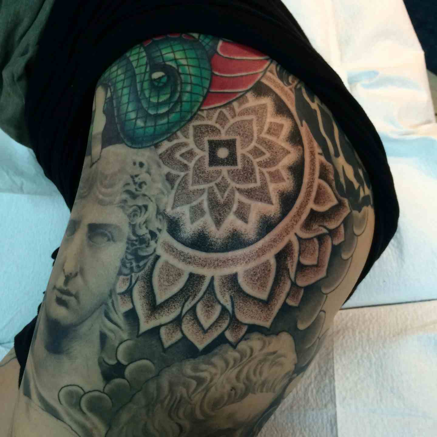 Geometric mandala dot work tattoo