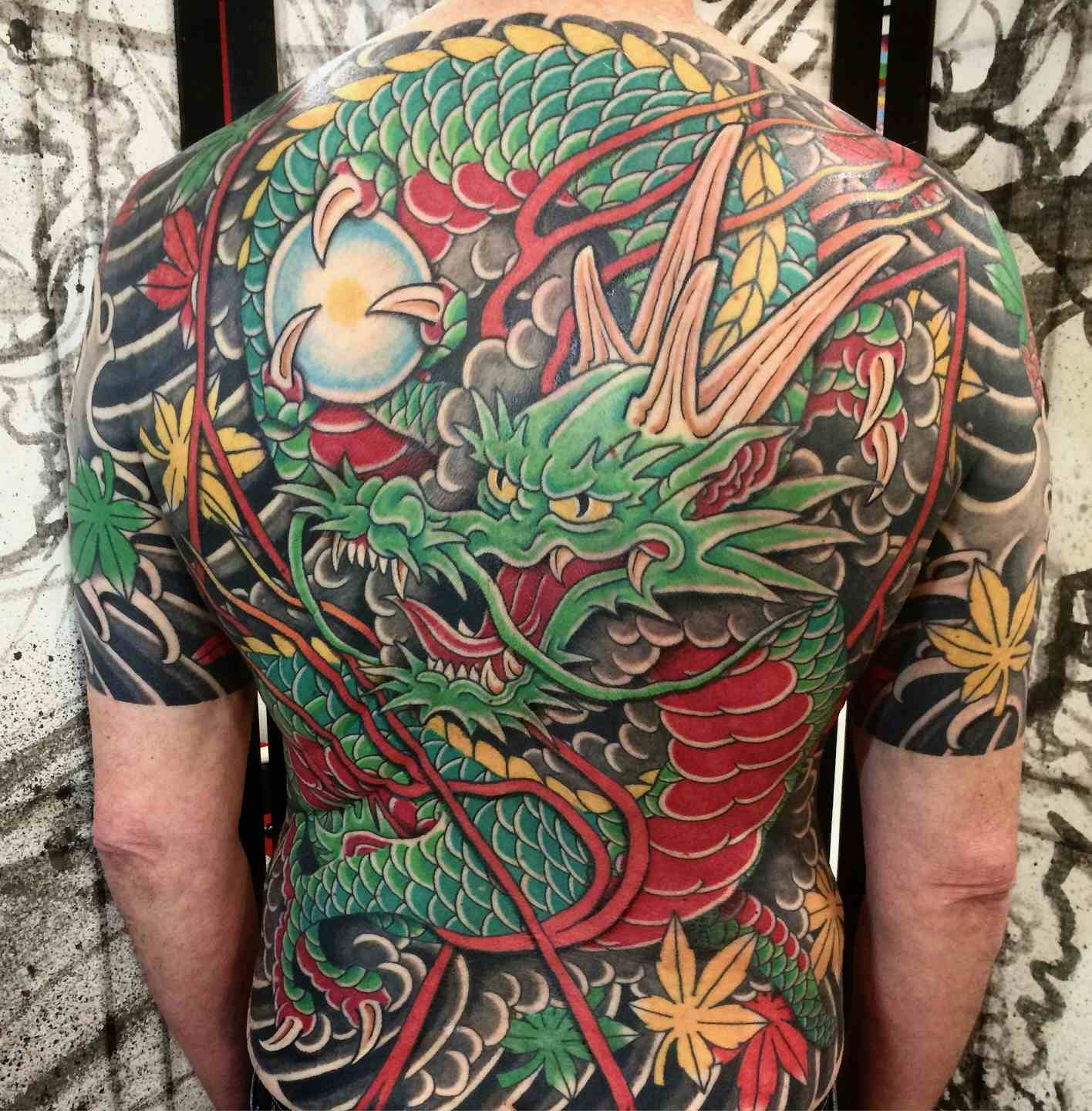 Dragon and lightening maple leaves tattoo
