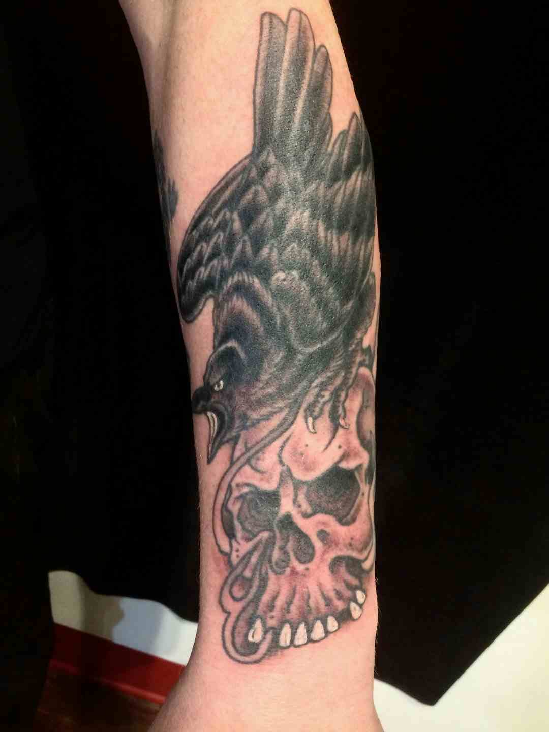 Raven skull tattoo