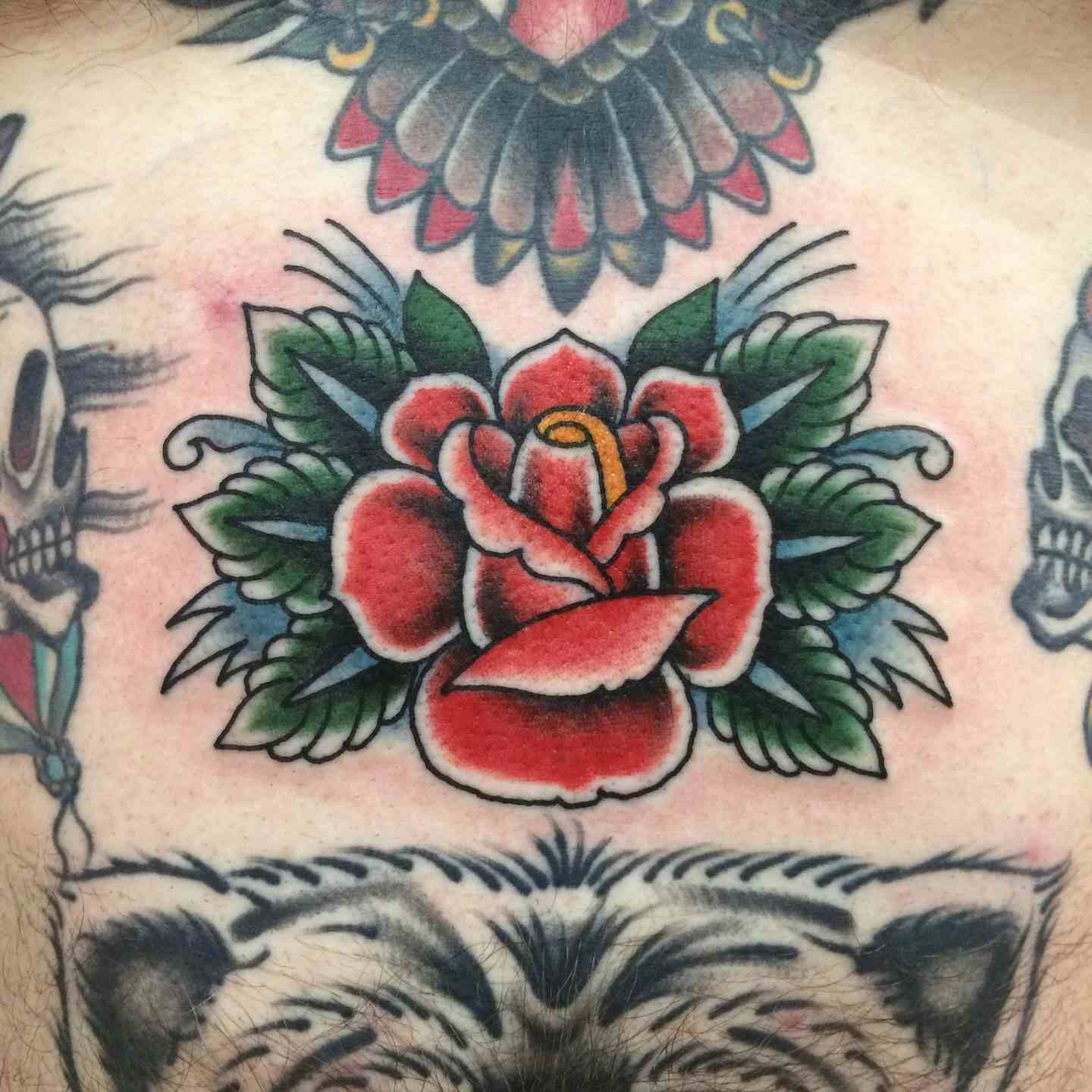 Sternum rose tattoo