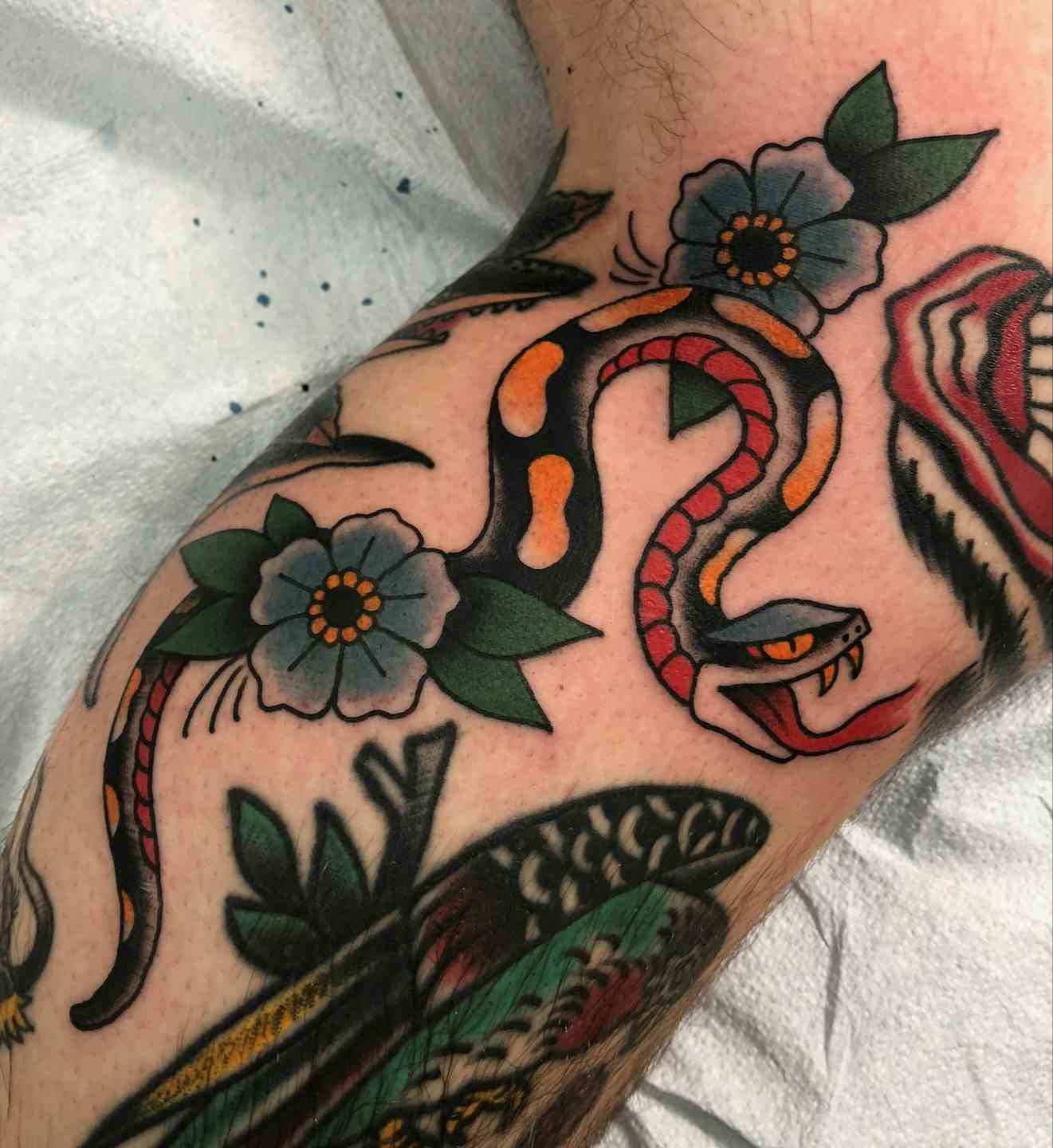 Traditional Snake flower tattoo