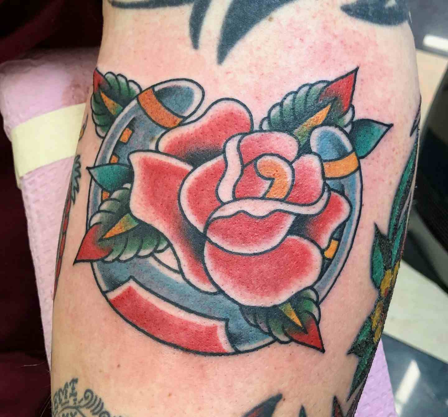American traditional horseshoe rose tattoo