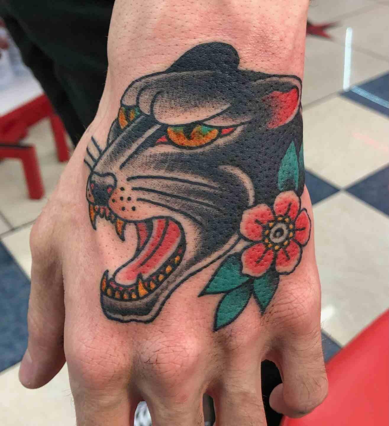 Panther hand tattoo
