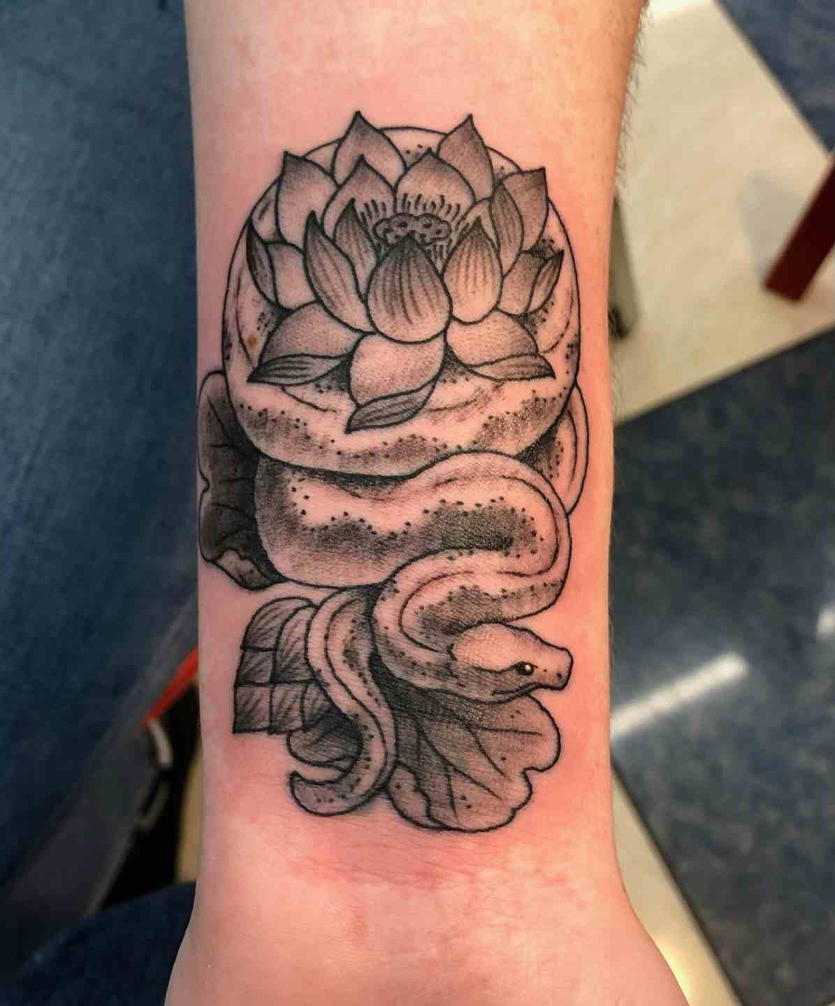 Snake and lotus tattoo