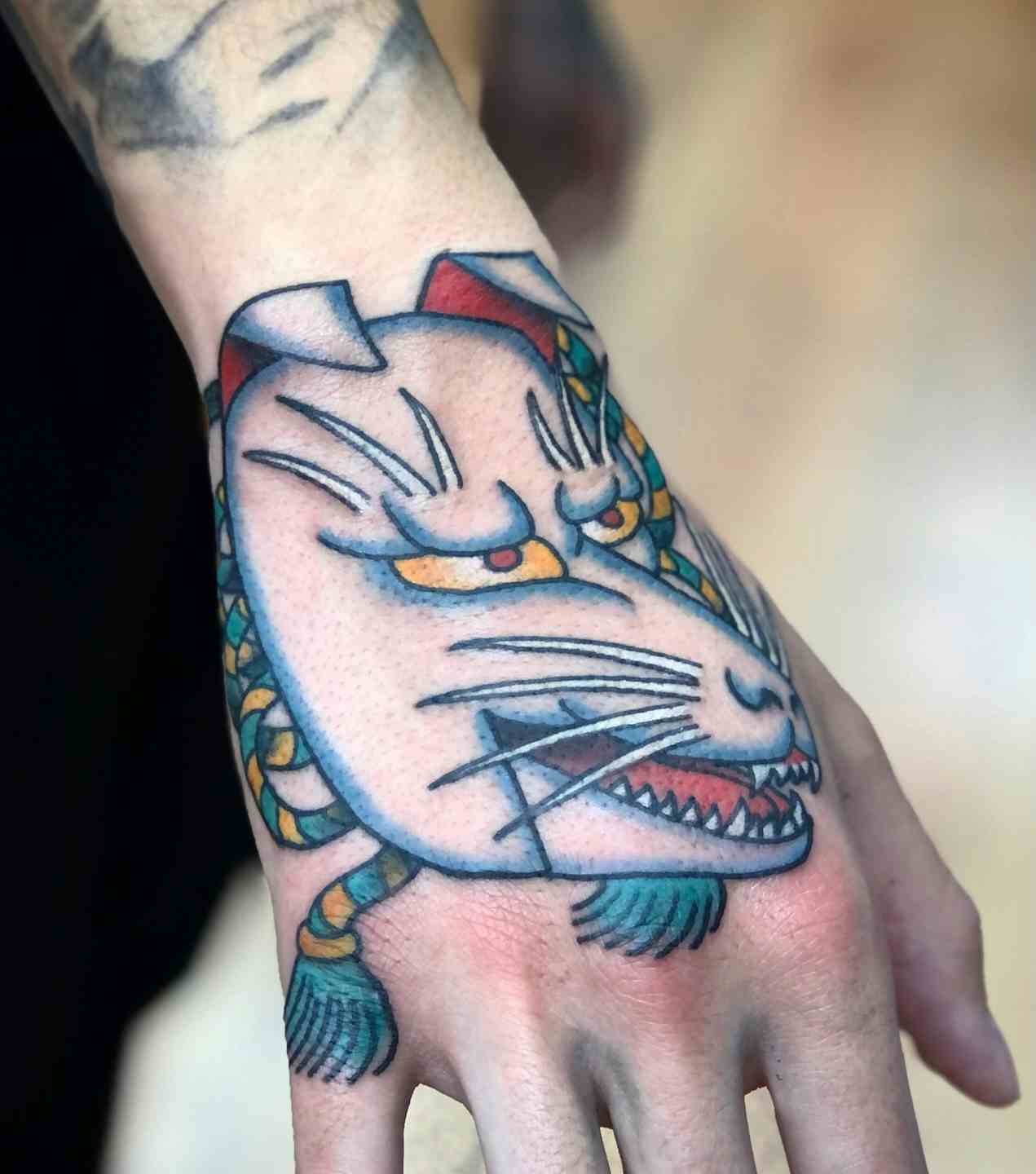 Japanese kitsune fox mask hand tattoo