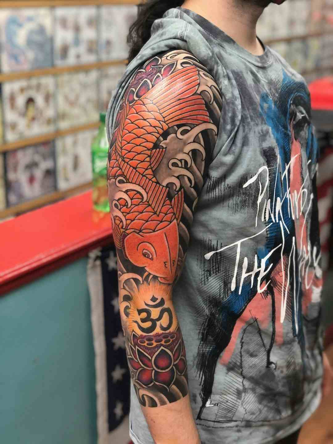 Koi fish lotus sleeve tattoo