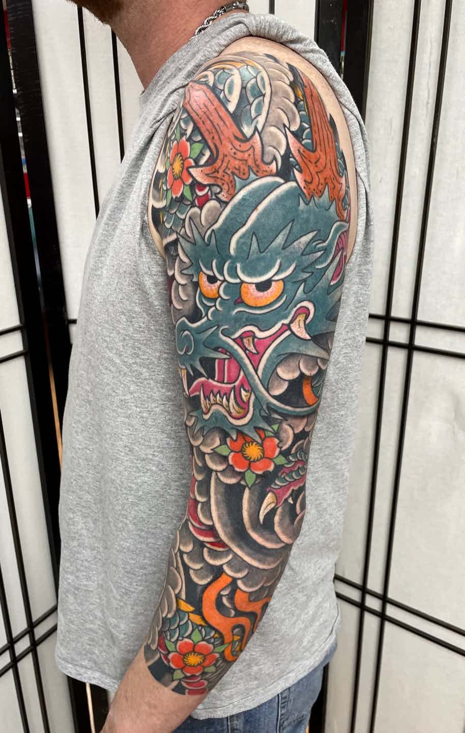 Dragon wind cherry blossom sleeve tattoo