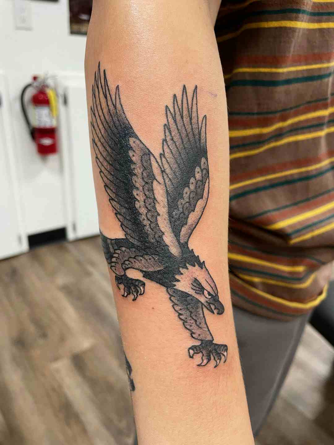 Traditional flying eagle tattoo