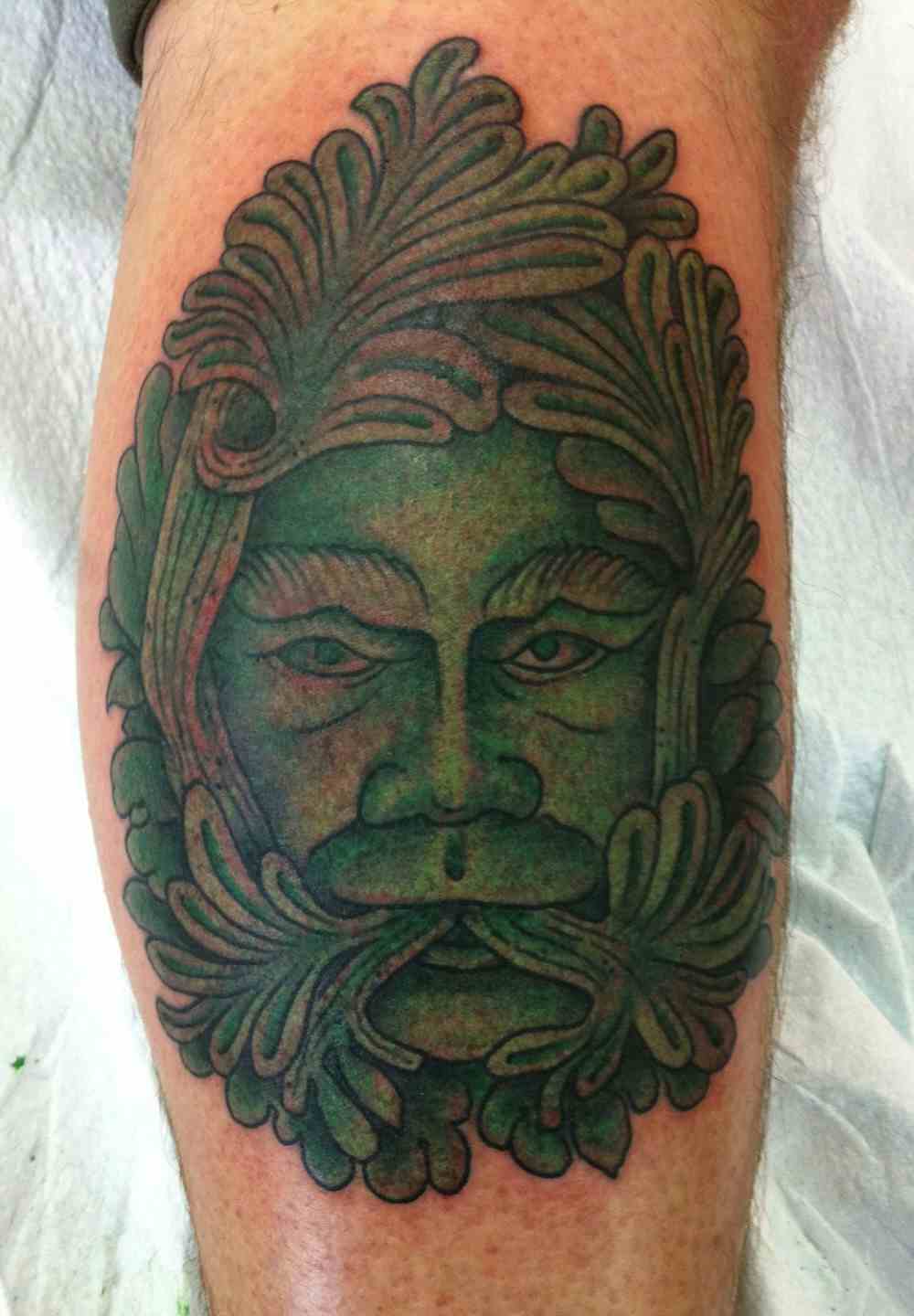 Green man tattoo