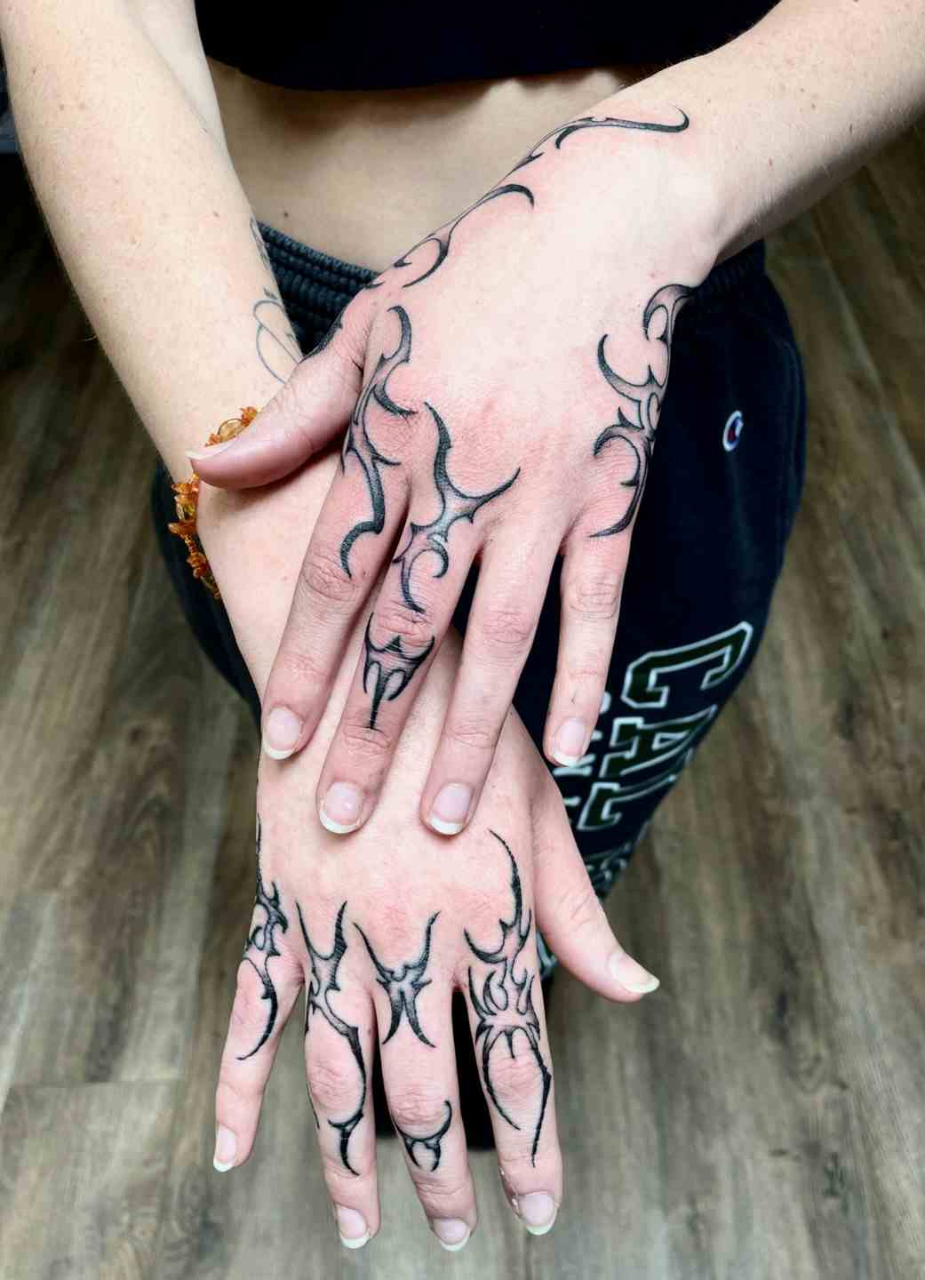 Gothic tribal hand tattoos