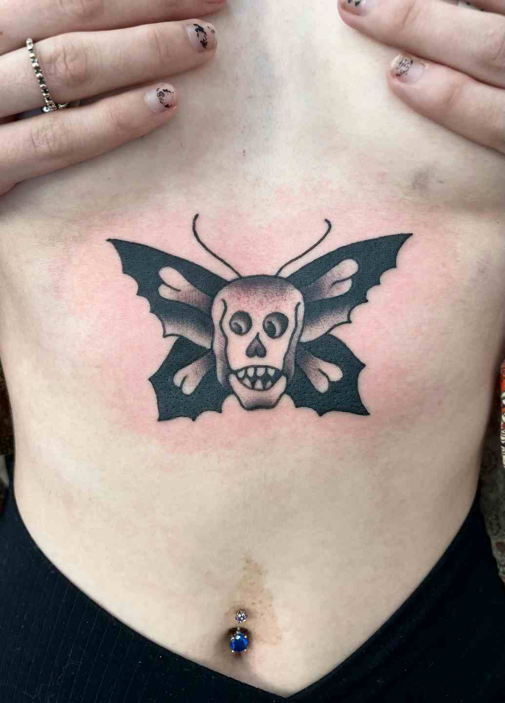 Traditional butterfly skull tattoo