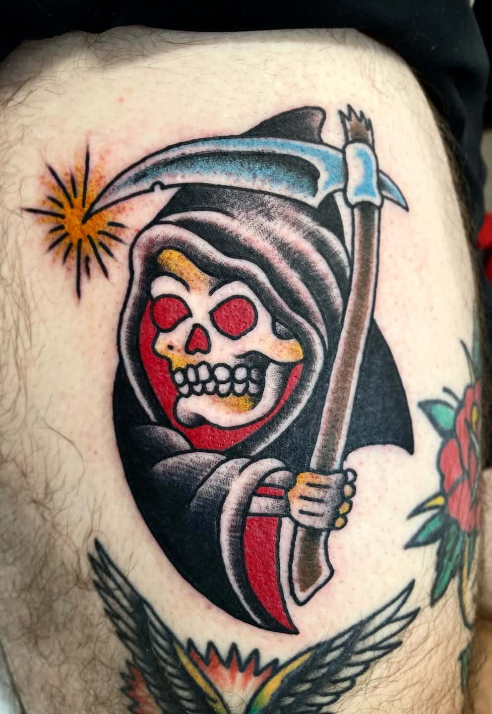 Traditional grim reaper skull tattoo