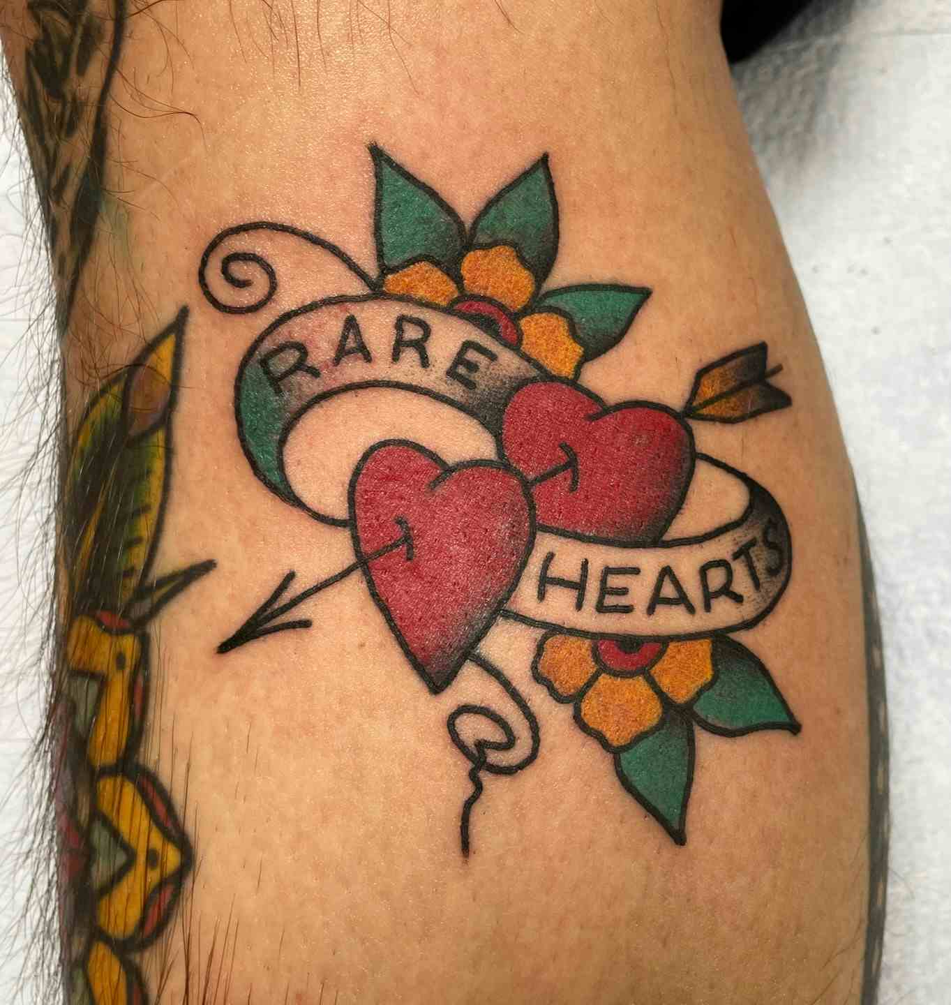 Traditional pair of hearts lovers tattoo
