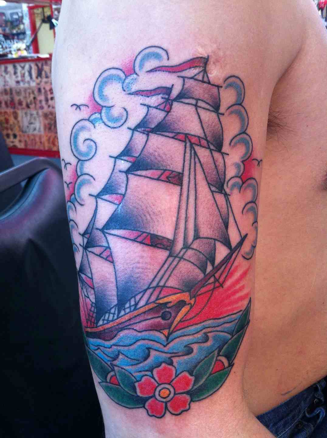 Ship with flowers tattoo
