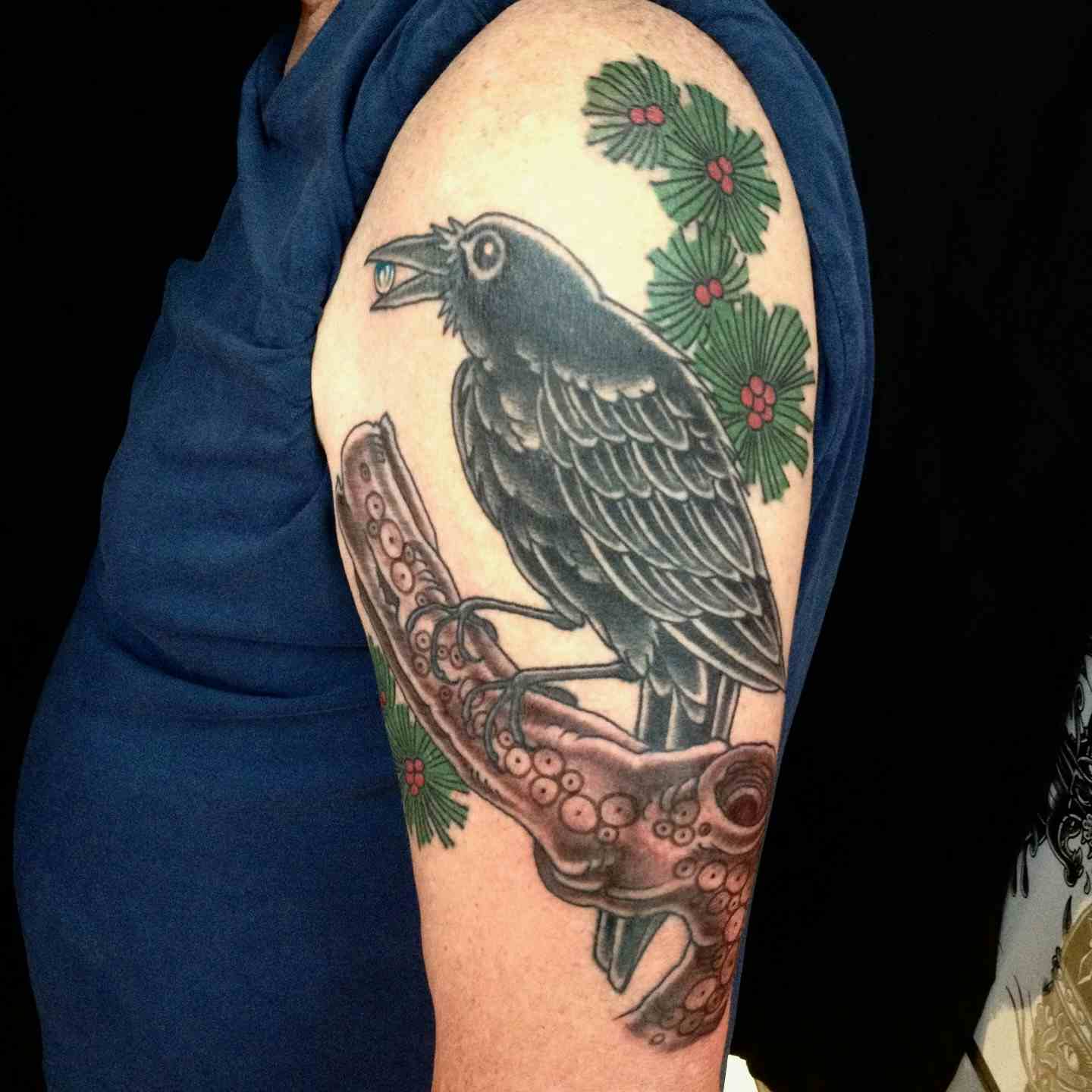 Crow pine branch tattoo