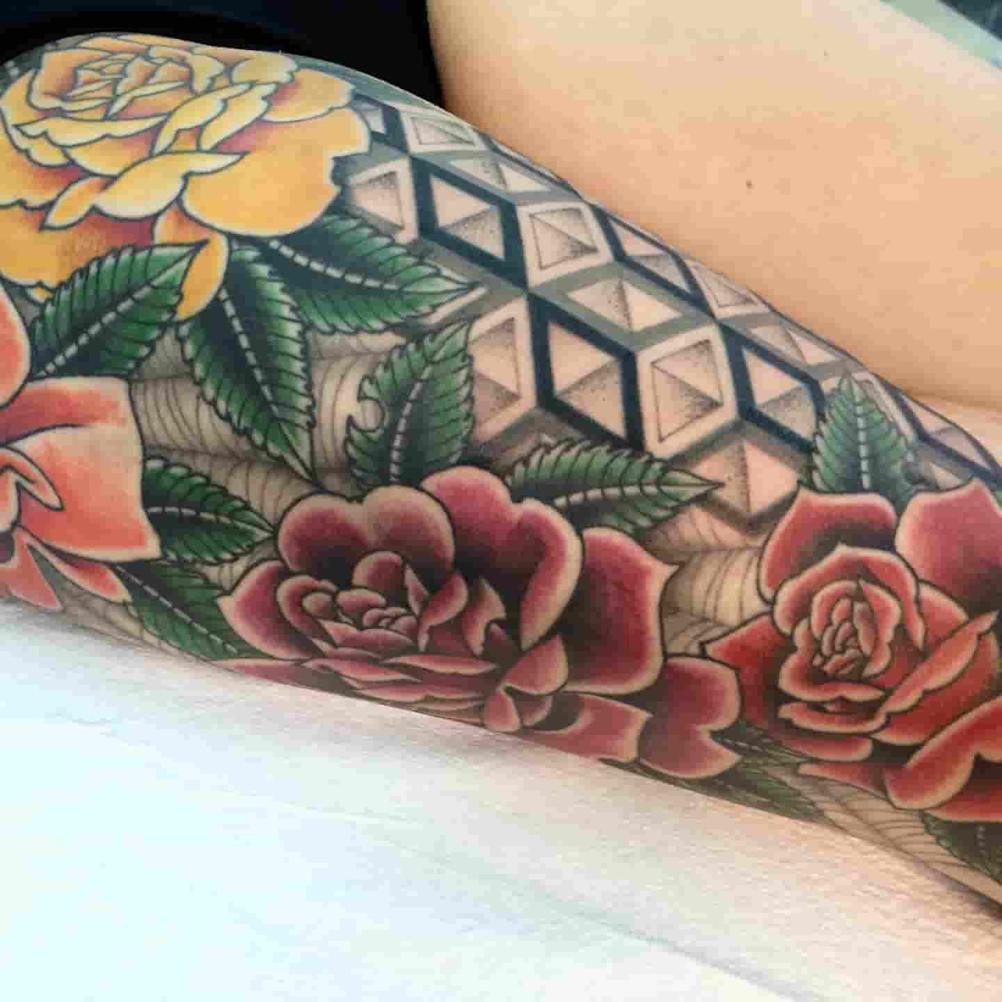 Geometric rose tattoo