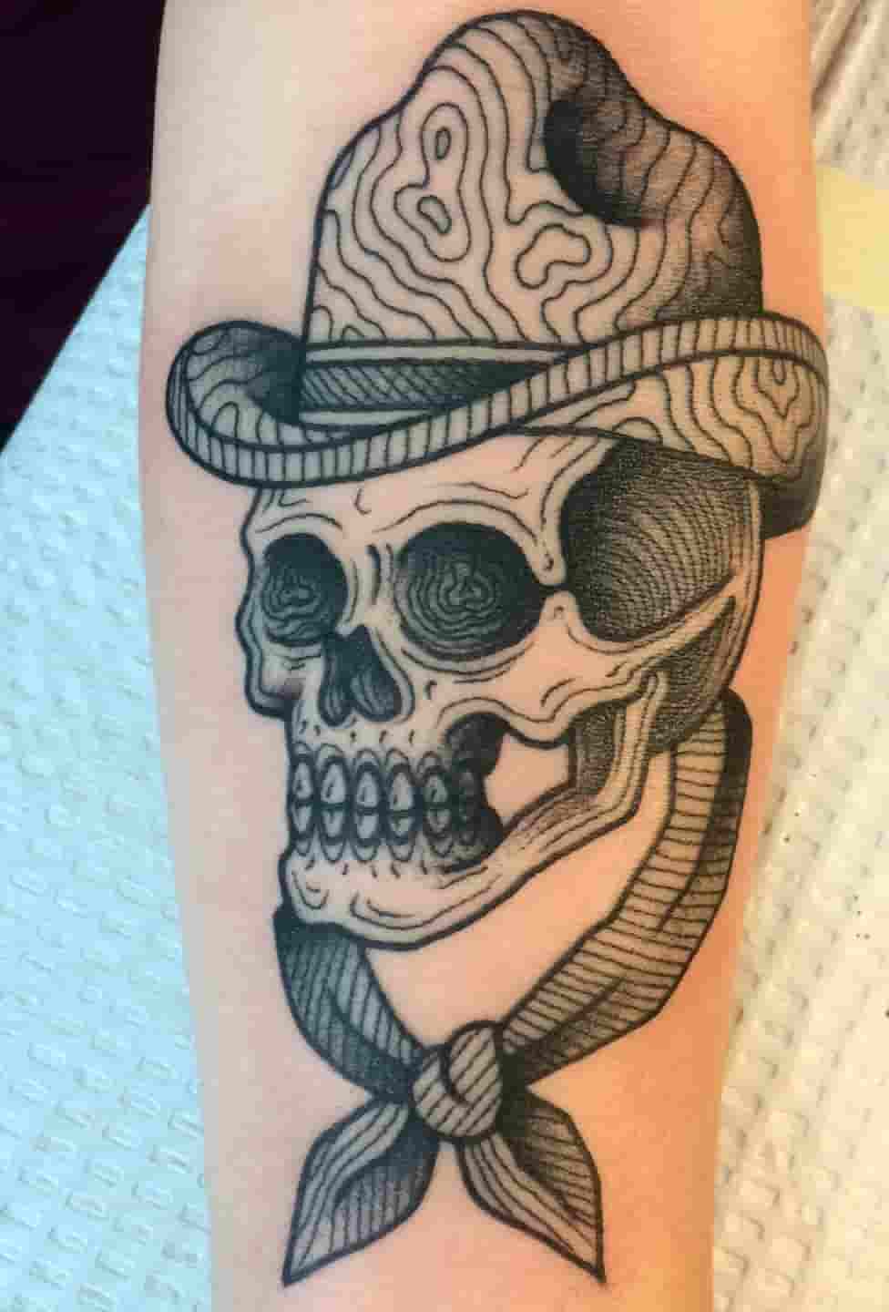 Wood grain cowboy skull tattoo