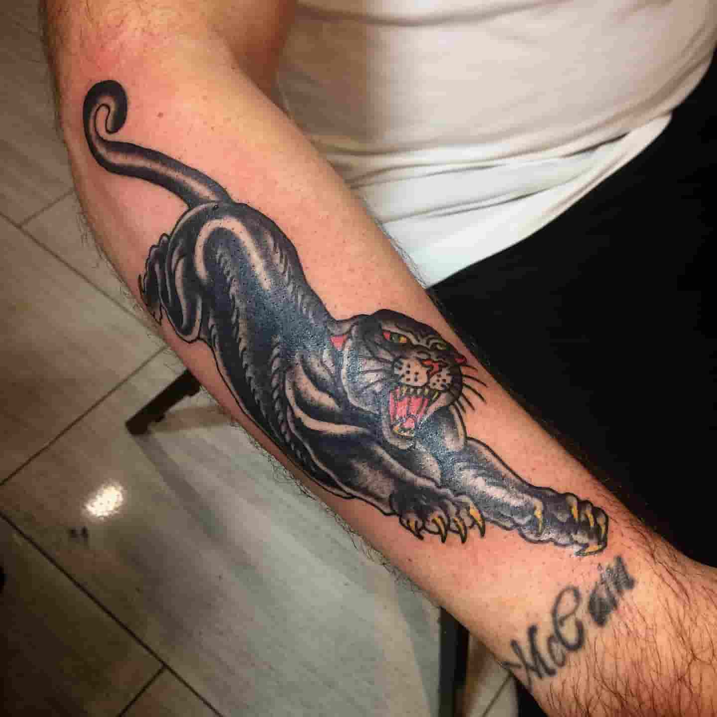 Jumping panther tattoo
