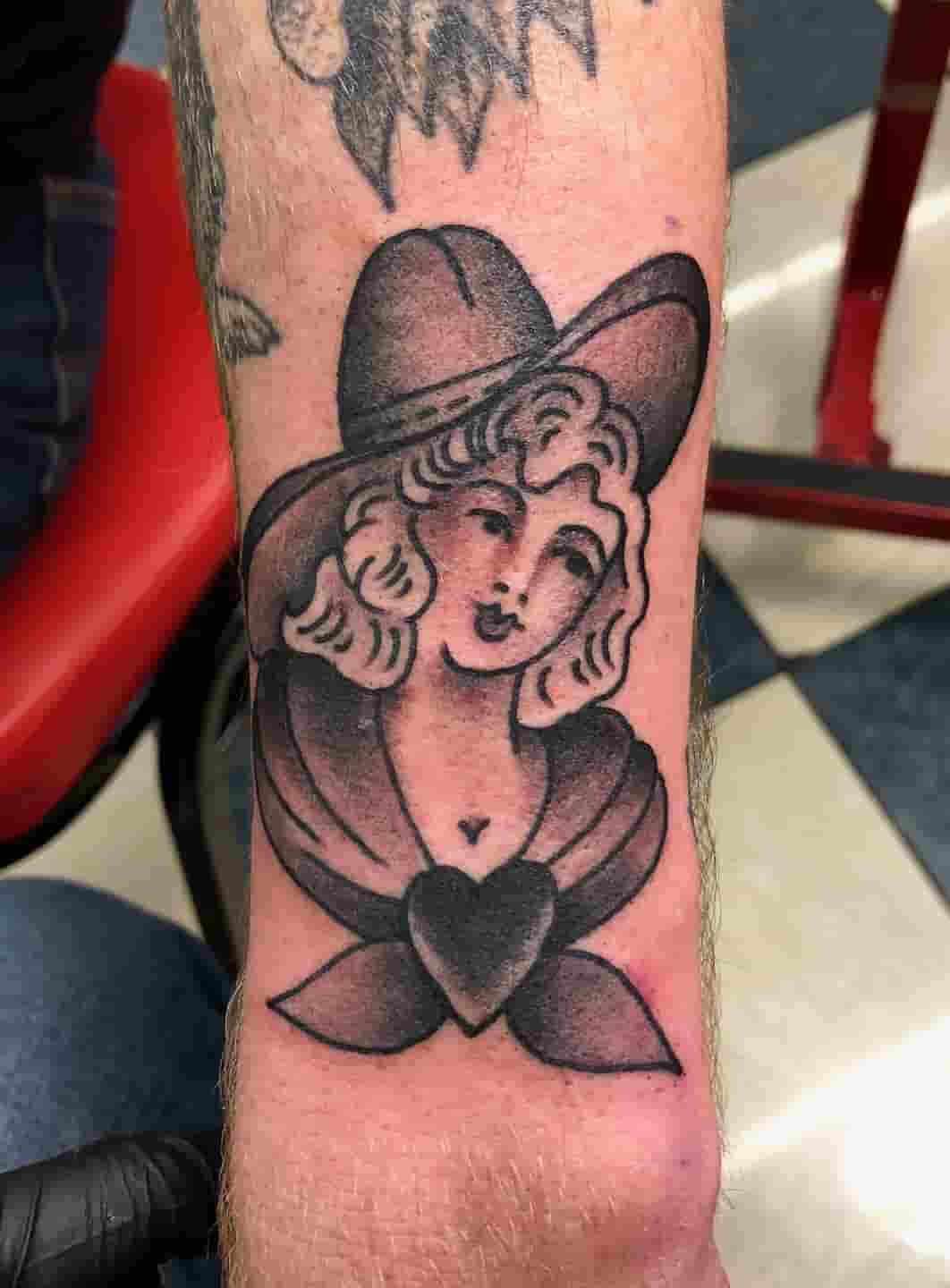 Blonde cowgirl tattoo