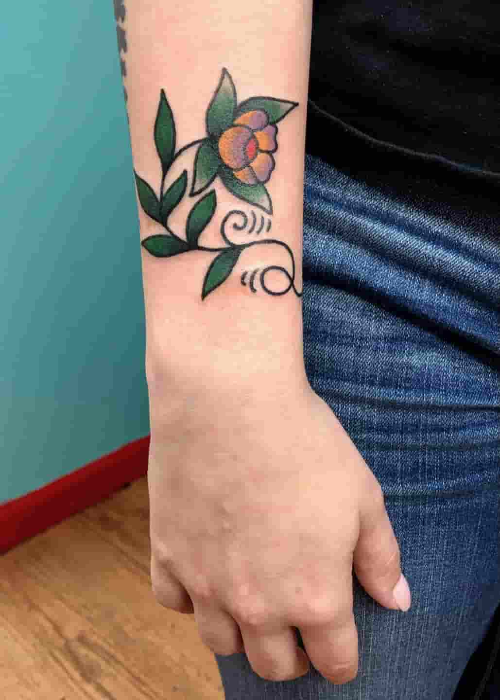 Flower wrist tattoo