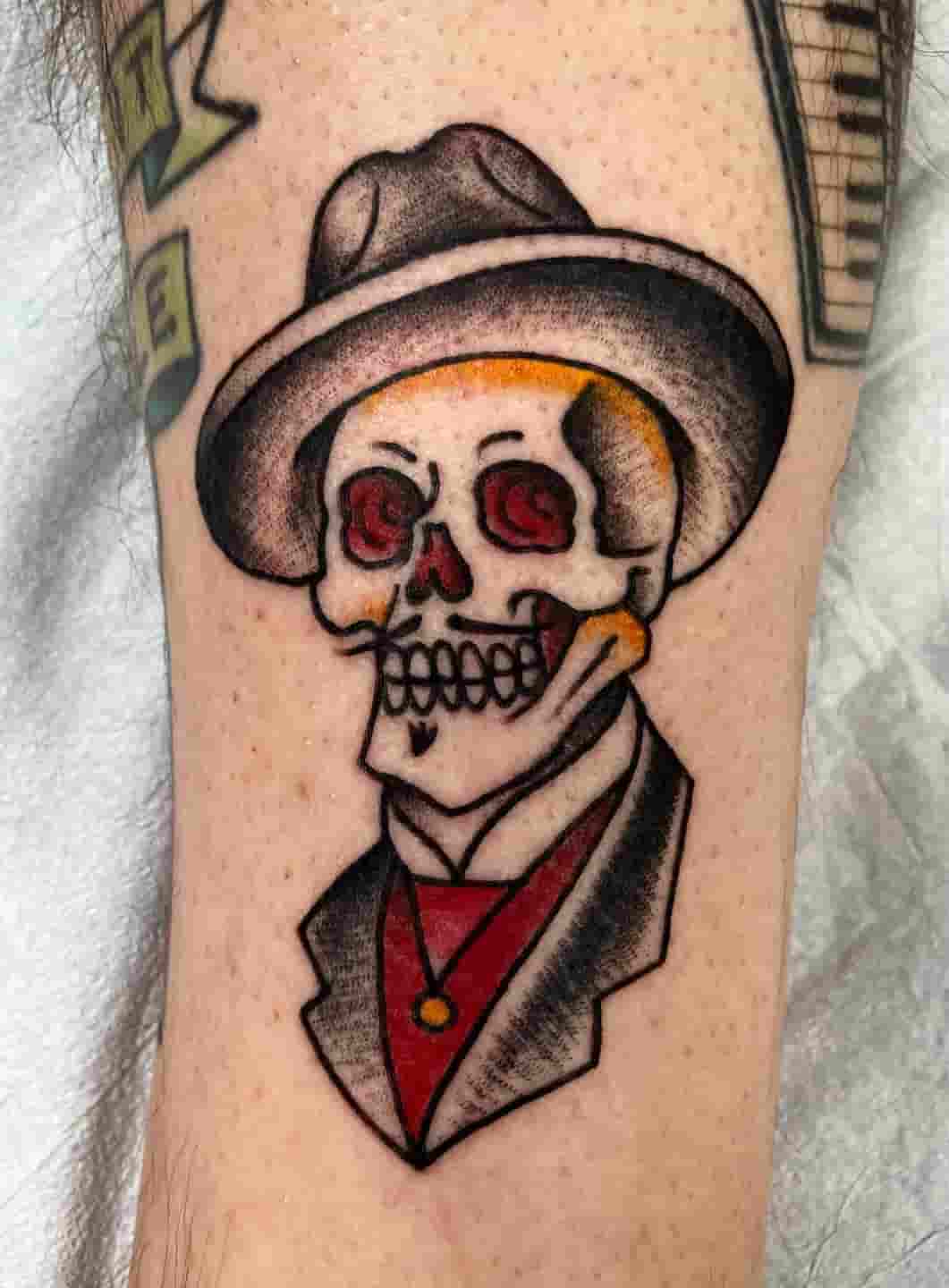 Traditional doc holiday skull tattoo