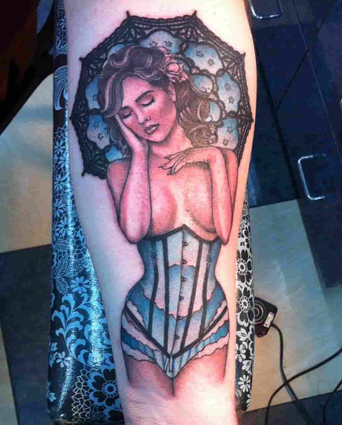 Pinup with umbrella tattoo