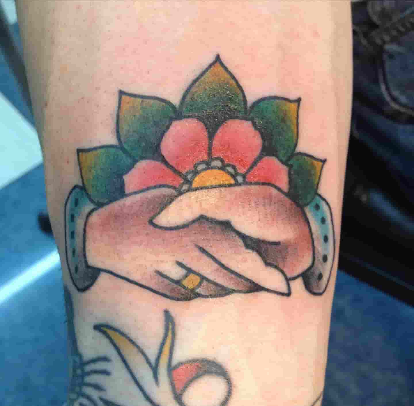Shaking hands tattoo