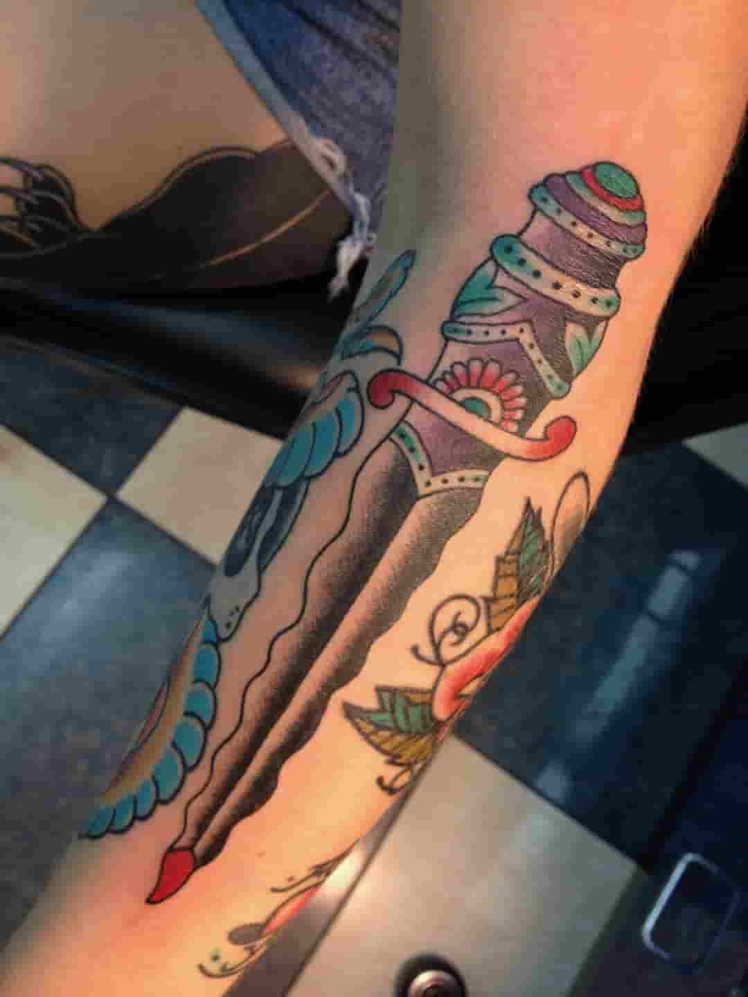 Purple dagger tattoo