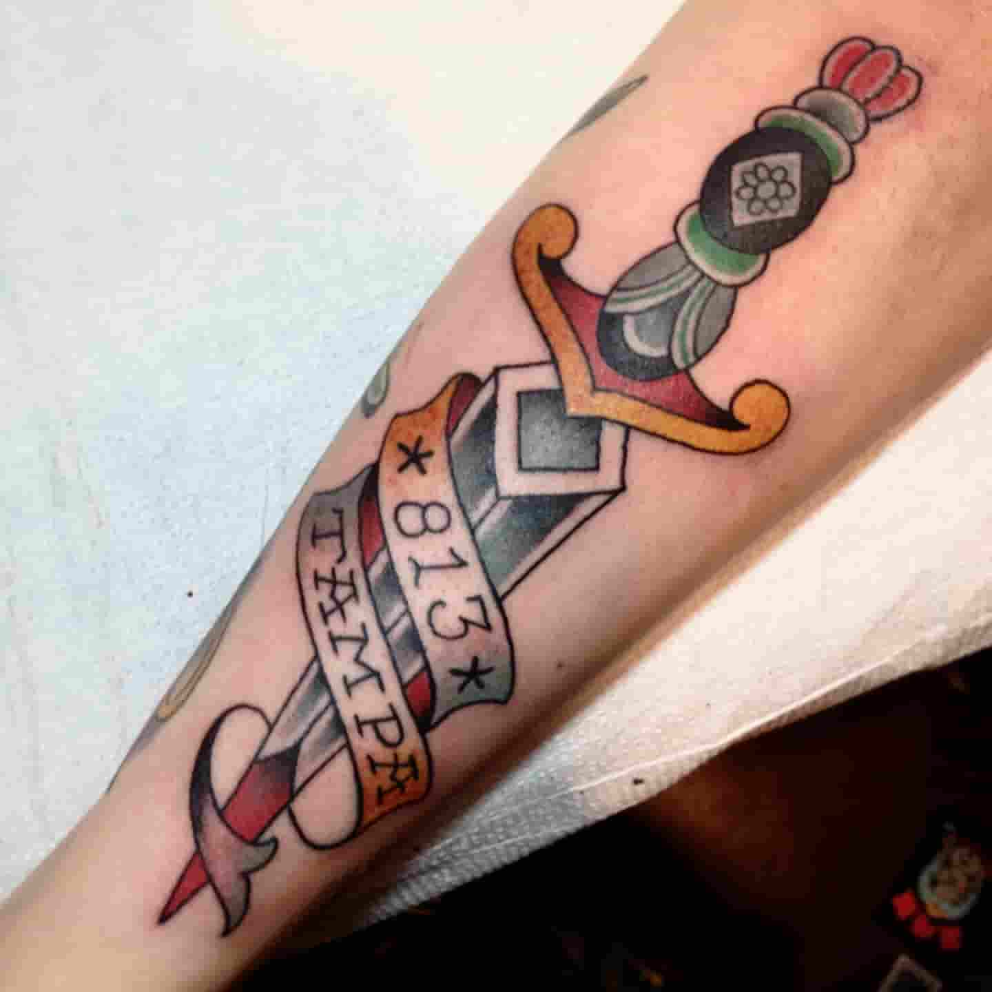 Dagger banner tattoo