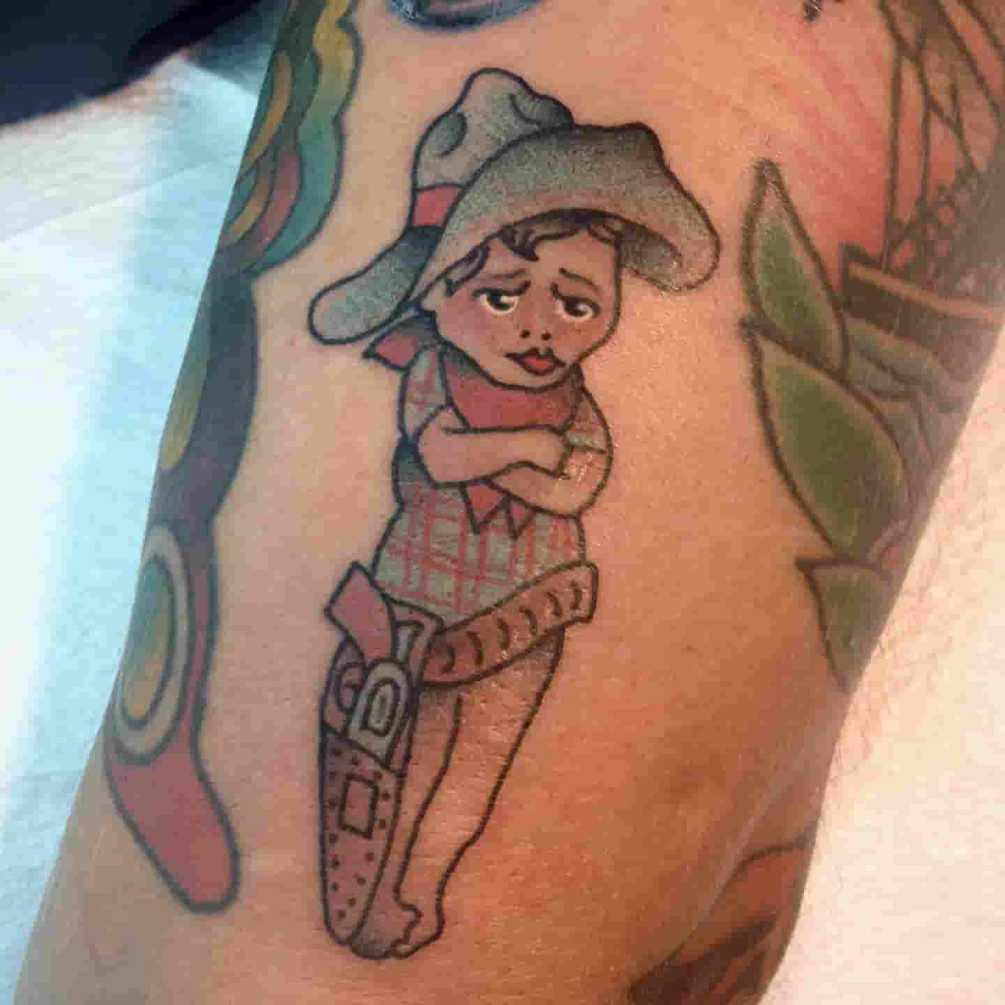 Cowboy kid tattoo